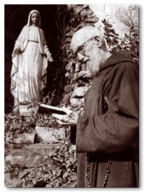 Fr. Solanus at the Lourdes Grotto in the friary garden in Detroit where he minstered as the doorkeeper for nearly 40 years.